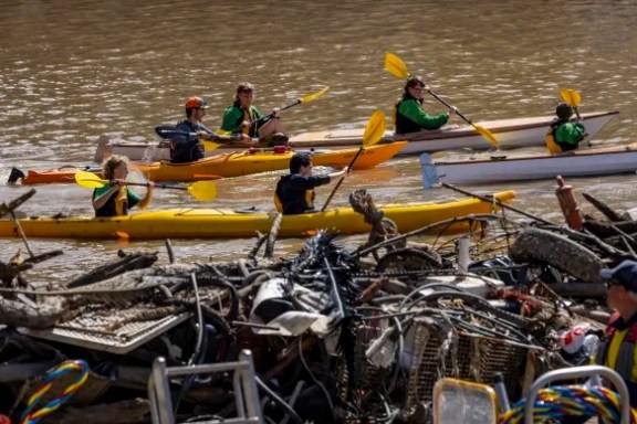 a group of people on a boat in the water