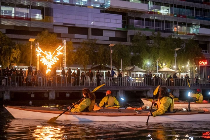 a group of people riding on the back of a boat